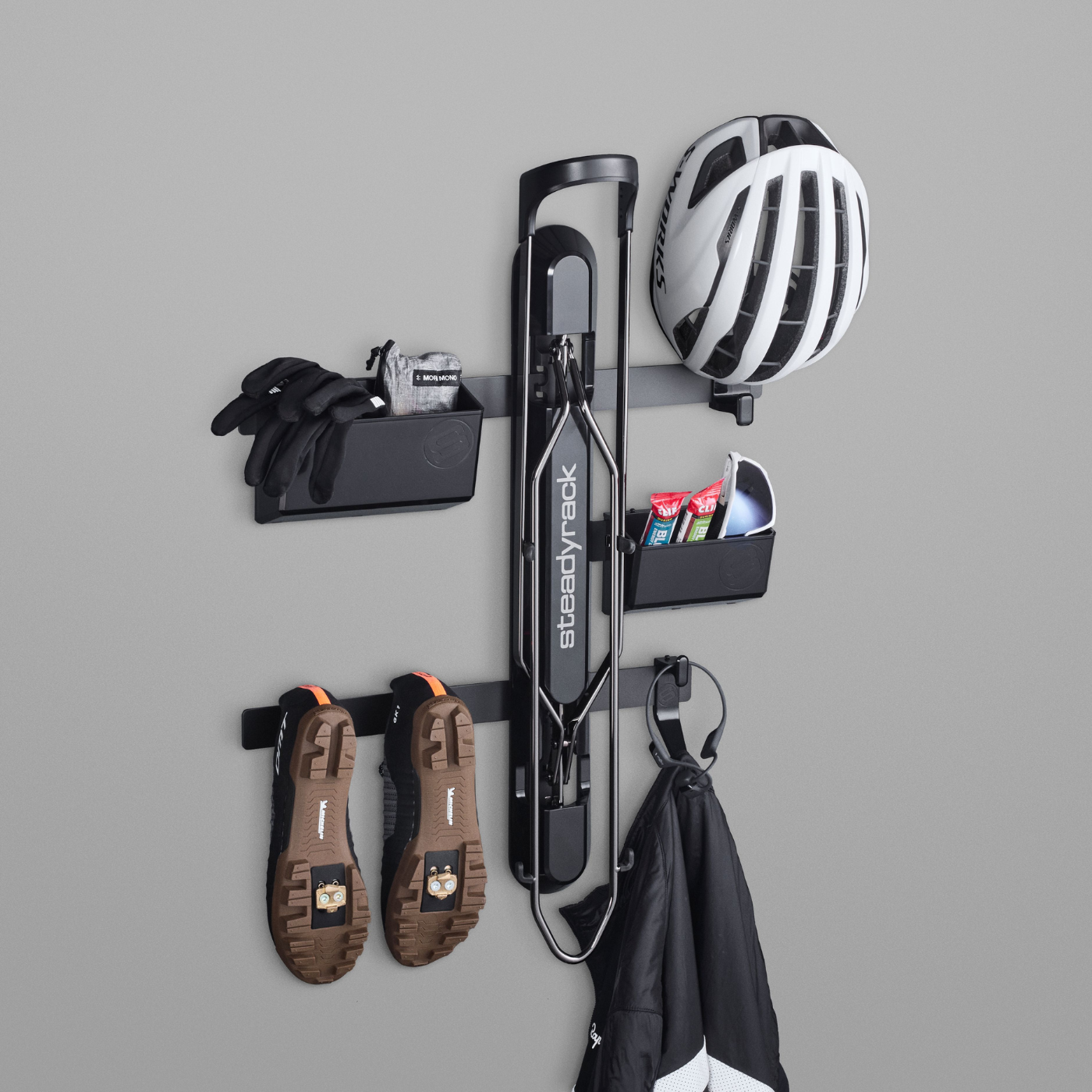 A ProFlex Rack with a black GearMate storage organiser system storing cycling gear, featuring various compartments and hooks.