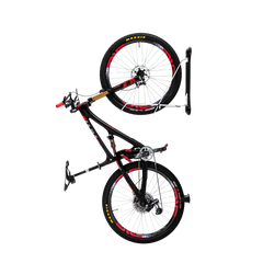 A Steadyrack Classic MTB Rack mounted on a wall, holding a mountain bike with red accents.