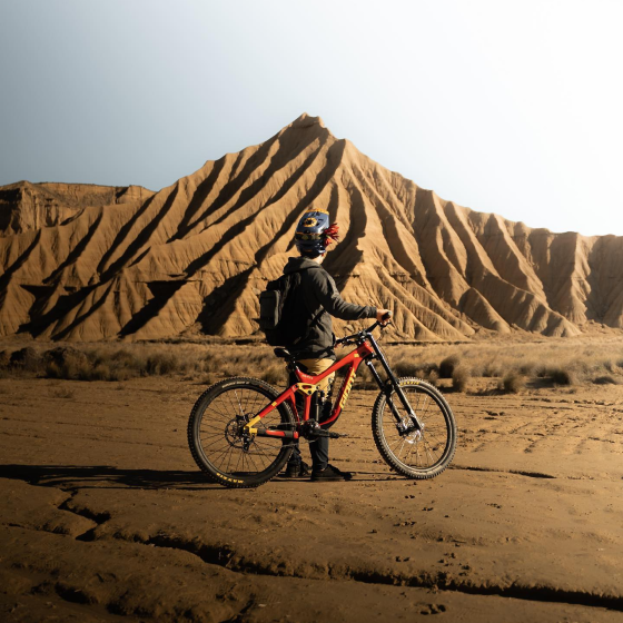 A person in the desert with their bike