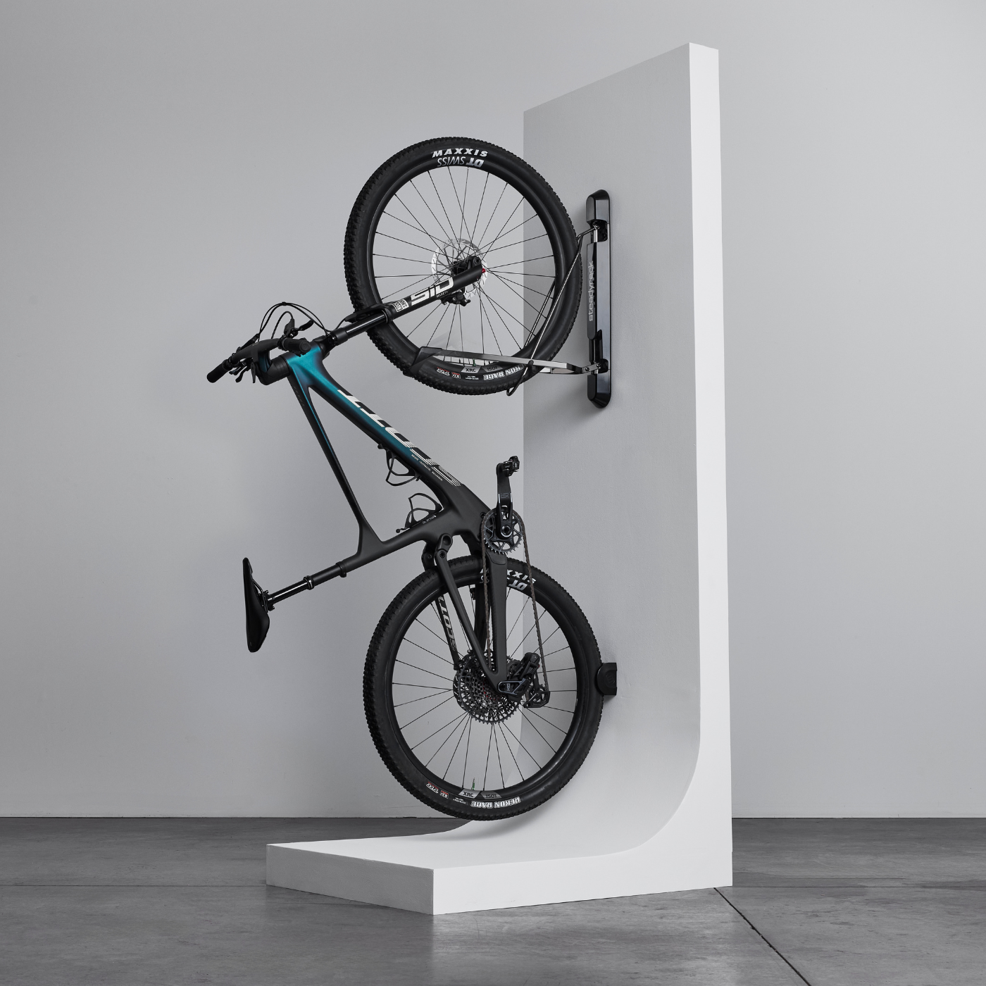 Bike mounted in a bike rack on a white background
