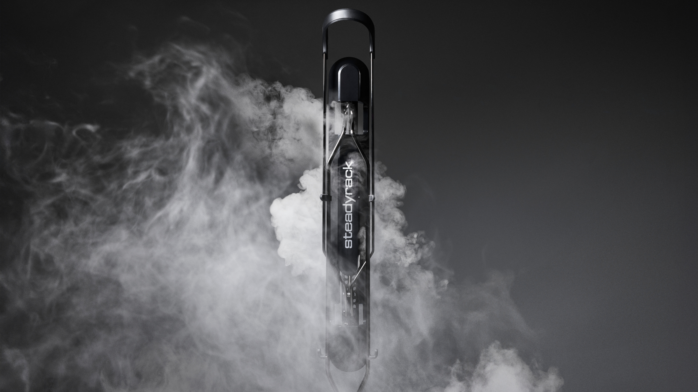 Black bike rack on a grey background with white smoke