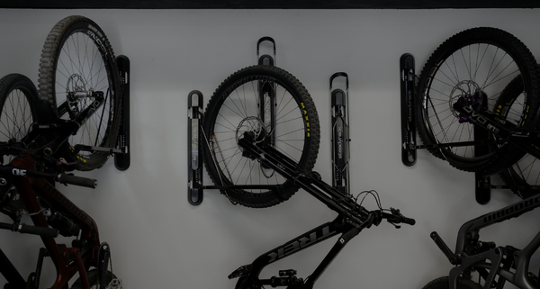 White background with black steadyrack bike racks with MTBs in them